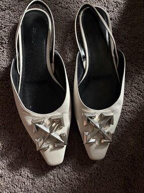 Off-White White Slingback Flats with Silver Arrow Emblem